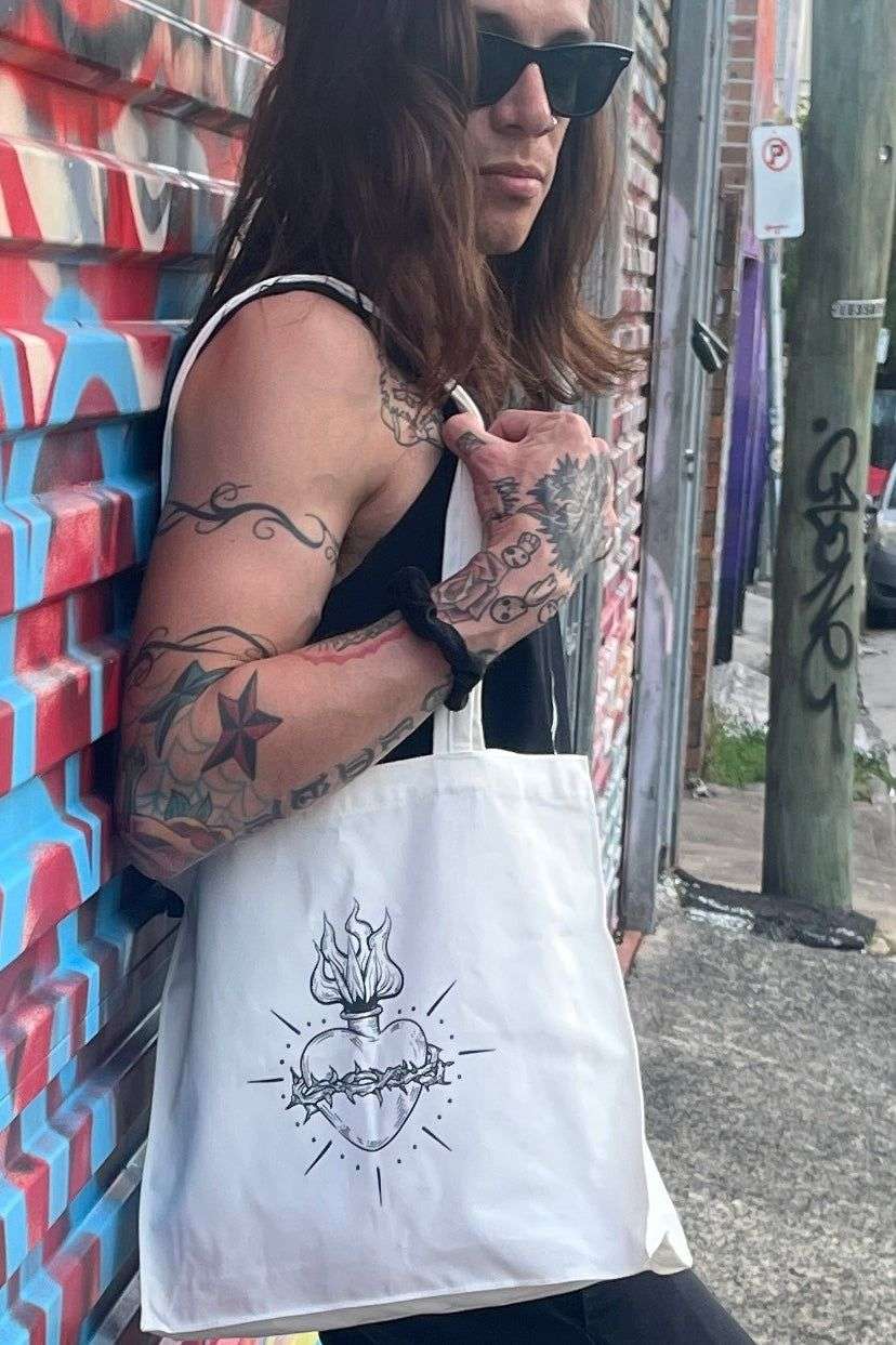 White cotton tote bag with tattoo style gothic sacred heart in black on the front