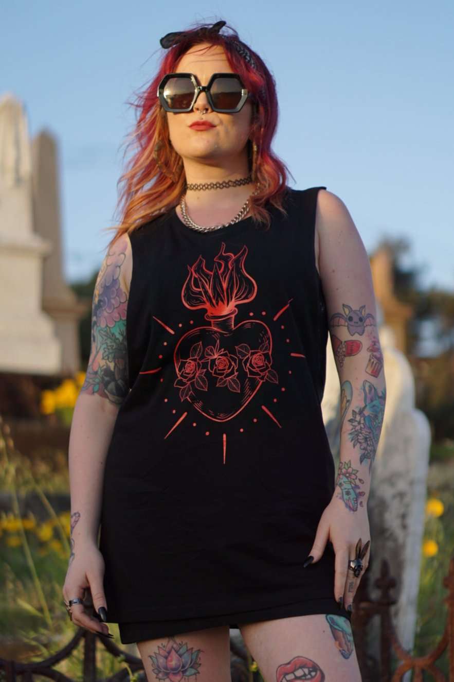 Queen of Hearts Tank/Dress worn as a dress by female model, showcasing red sacred heart design in alternative goth fashion style.