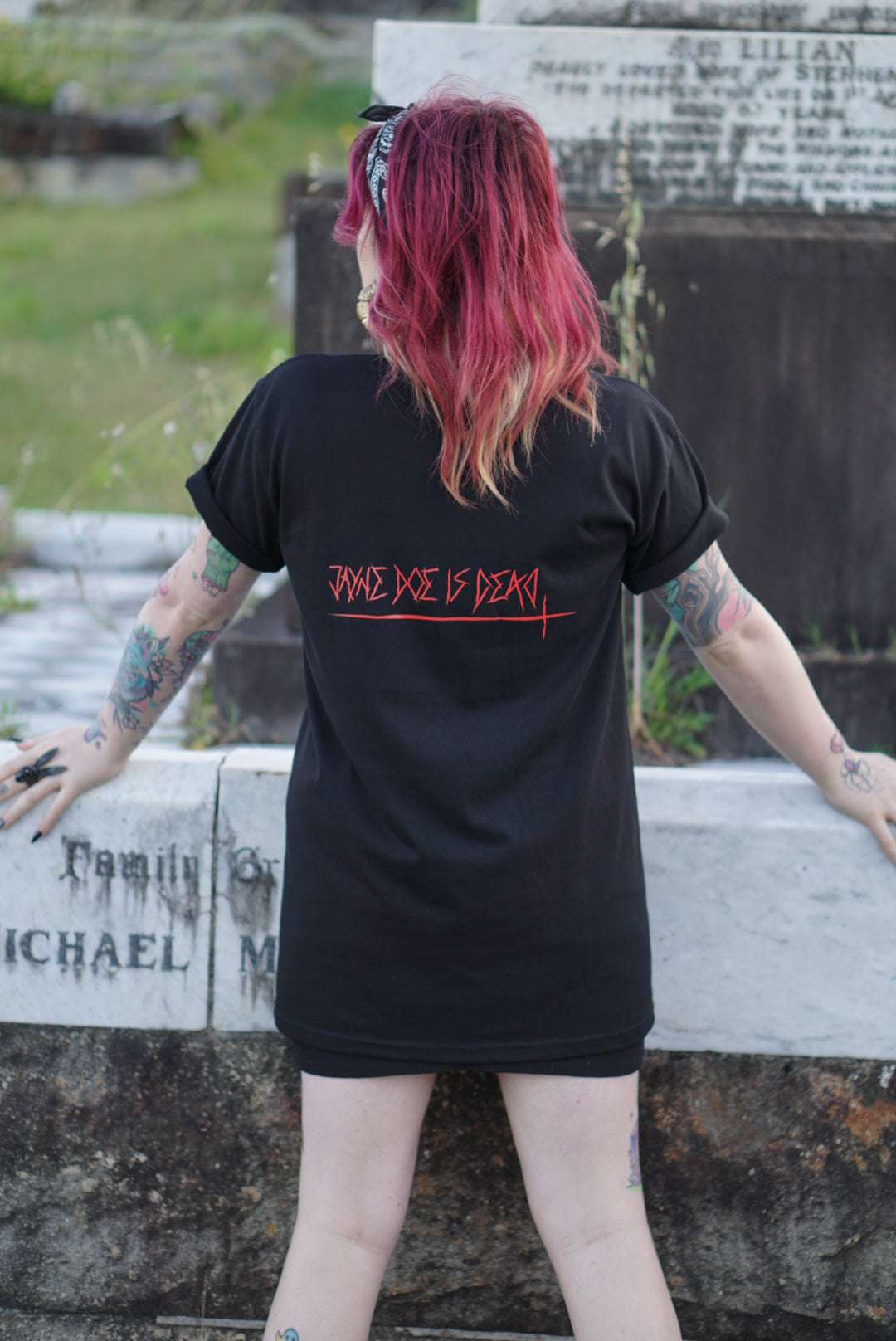 Off With Their Heads Xtra Long Tee / Dress in black with red 'JAYNE DOE IS DEAD' text on back, styled as a dress in gothic streetwear fashion.