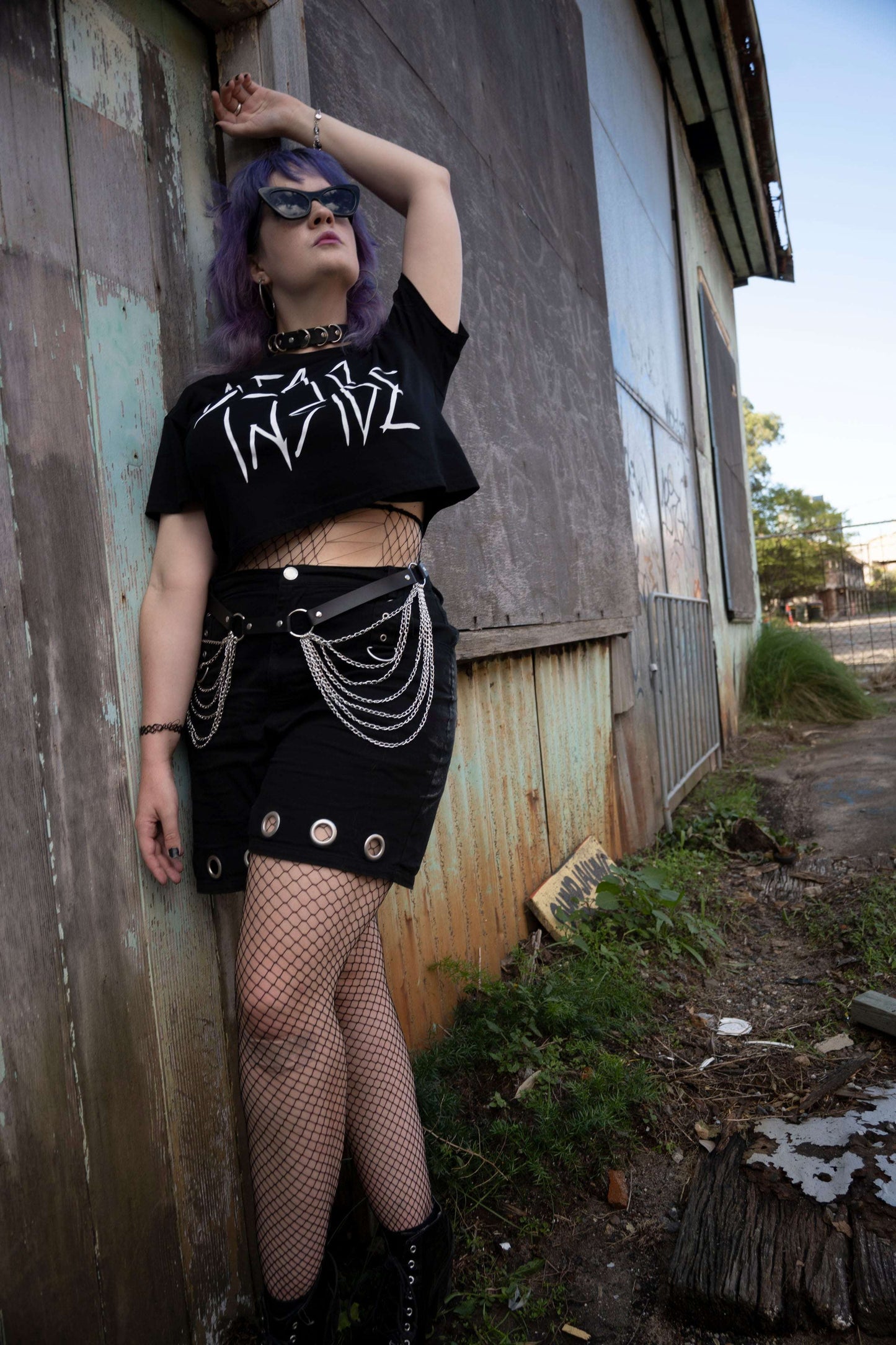 Goth girl wearing a black cropped Tshirt with dead inside printed on the front in white gothic style font