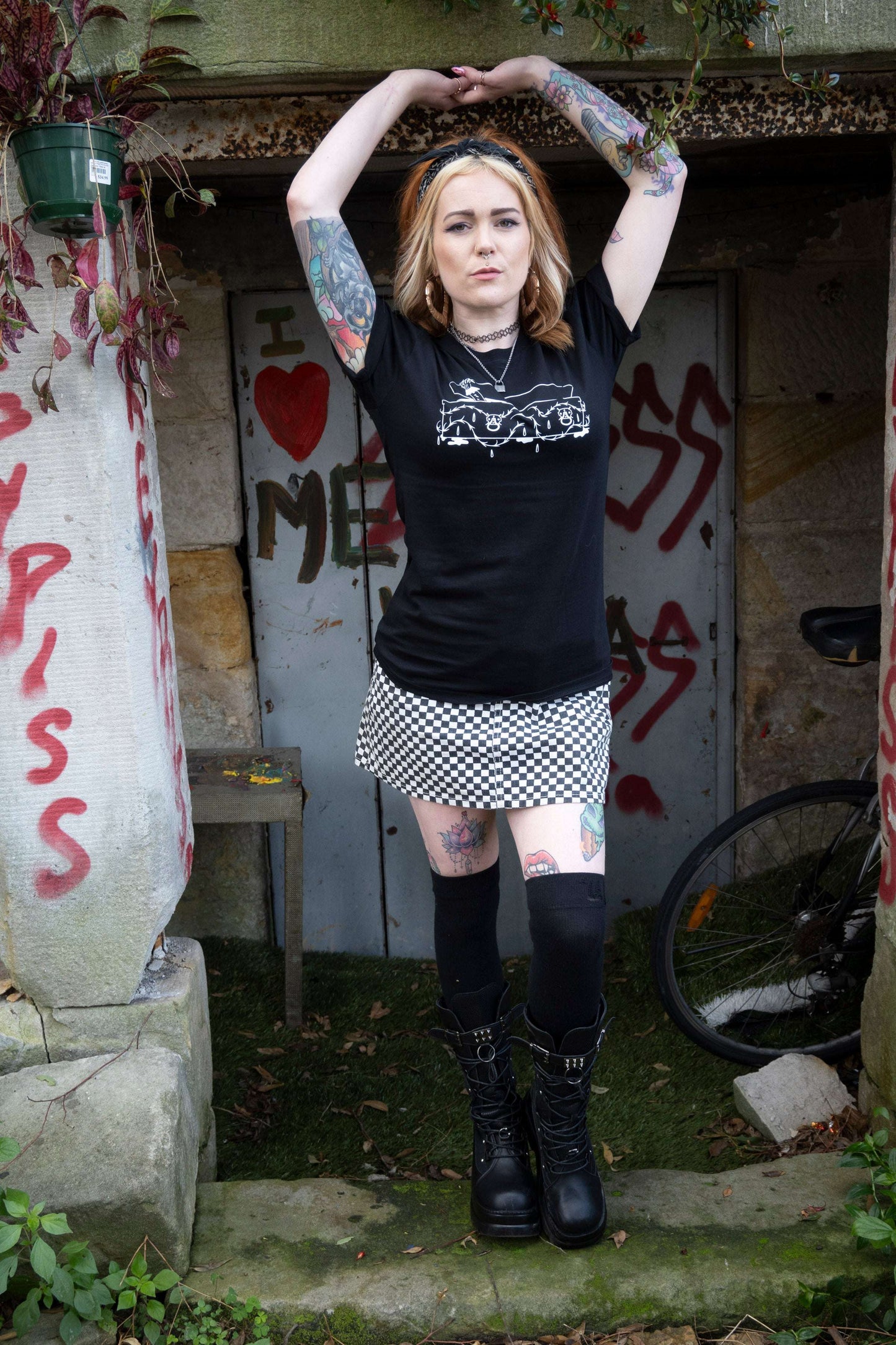 Black tshirt with intricate coffin with vampire hand emerging on the front