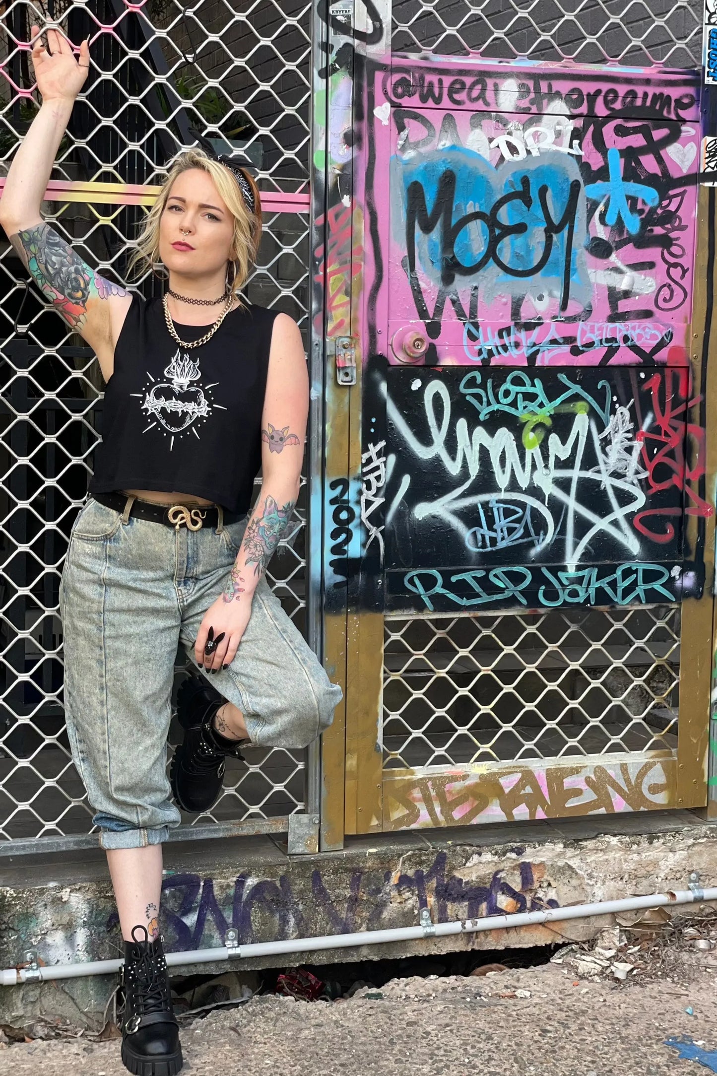 Black cropped tank with raw arm holes with tattoo style gothic sacred heart in white on the front & jayne doe is dead printed on the back.