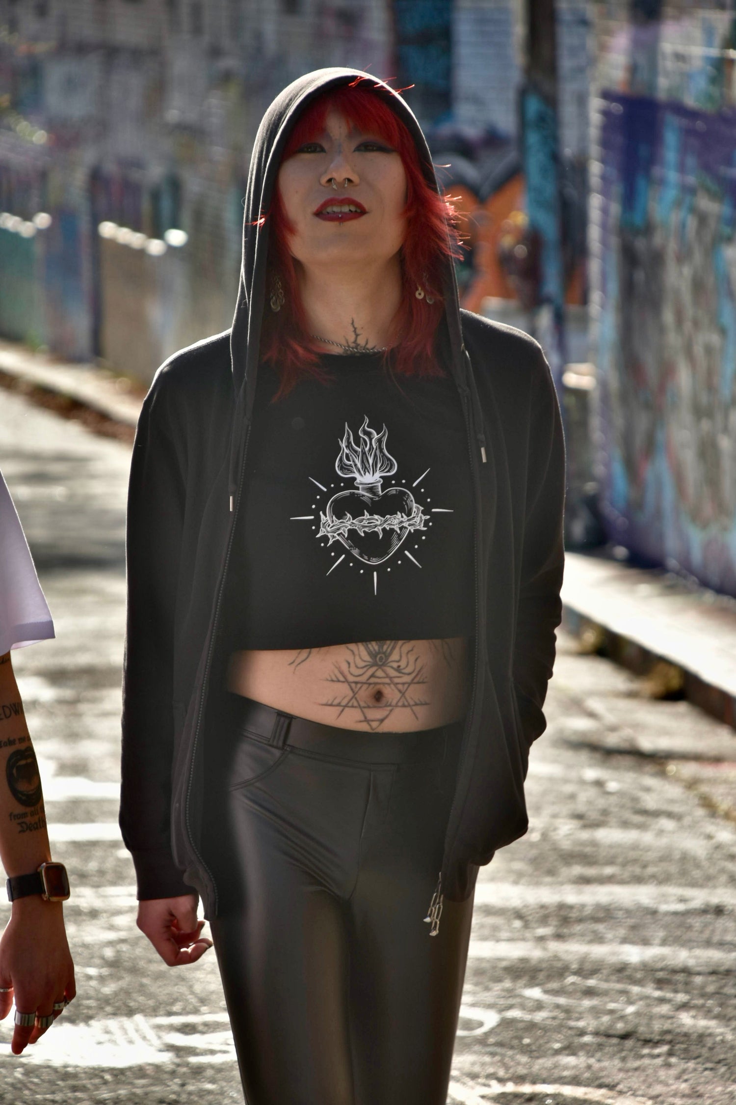 Black cropped tshirt with tattoo style gothic sacred heart in white on the front & jayne doe is dead printed on the back.